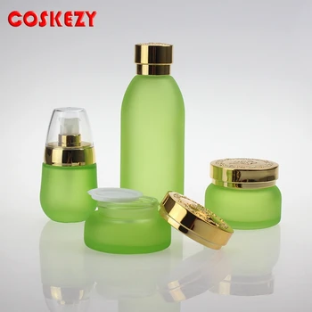 Е 30-граммовая светло-зелено стъклено бурканче за крем с блестяща сребърно-златна ABS-капак, стъклена козметична опаковка с тегло 30 грама